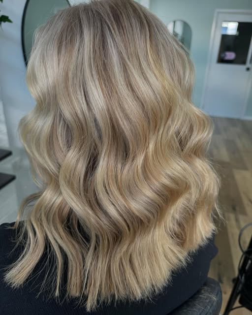 Half head foils through the top and sides, styled in waves
